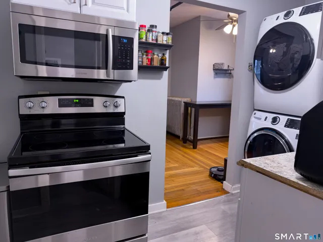 a kitchen with a stove and a microwave