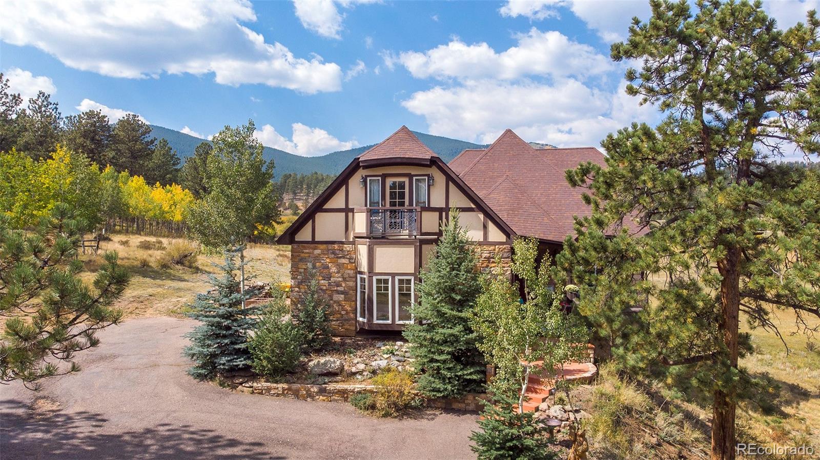 416 Conestoga Road Bailey, CO 80421 - Photo 1 of 40 a view of a house with a yard