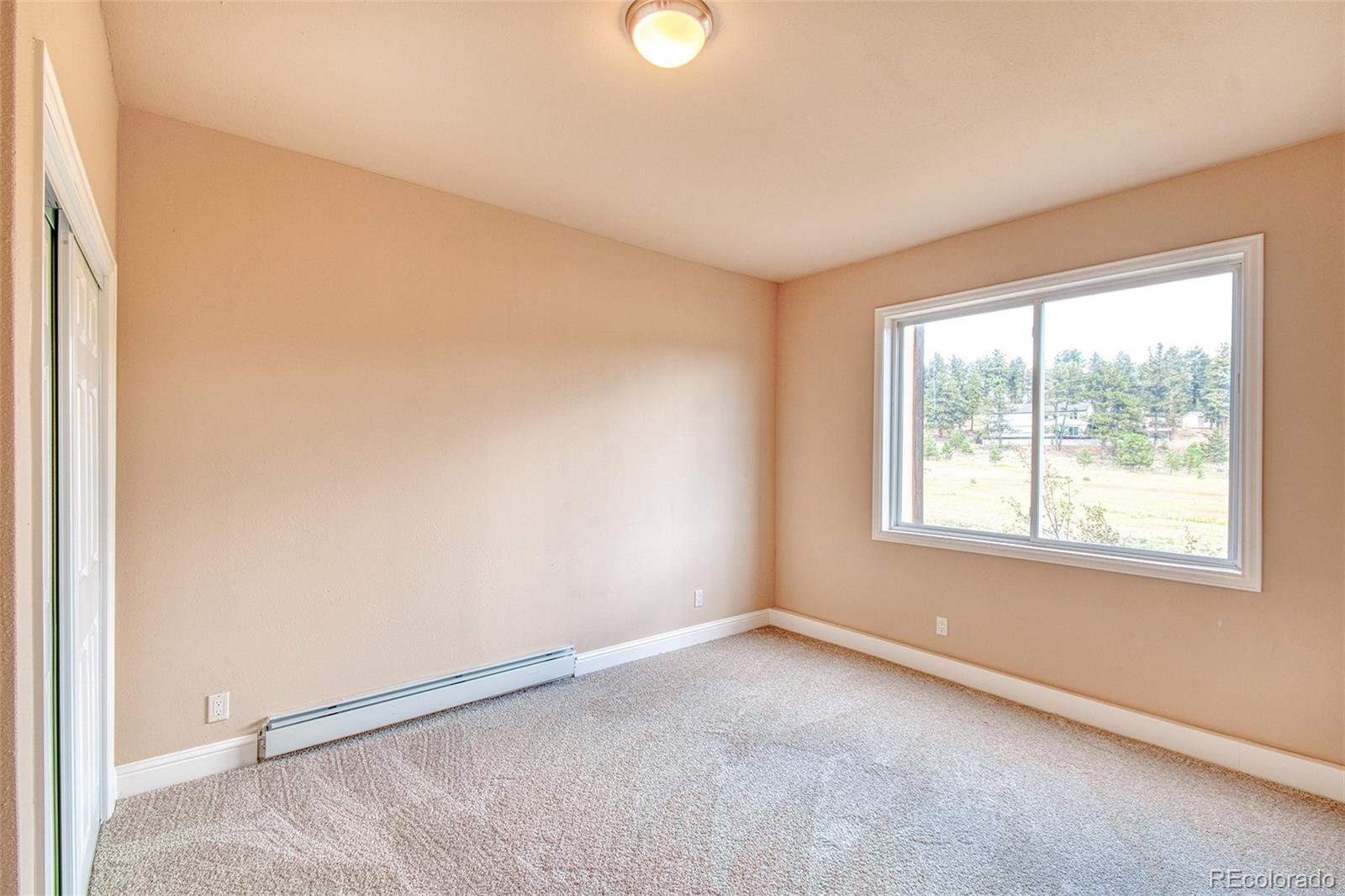 416 Conestoga Road Bailey, CO 80421 - Photo 27 of 40 an empty room with a window