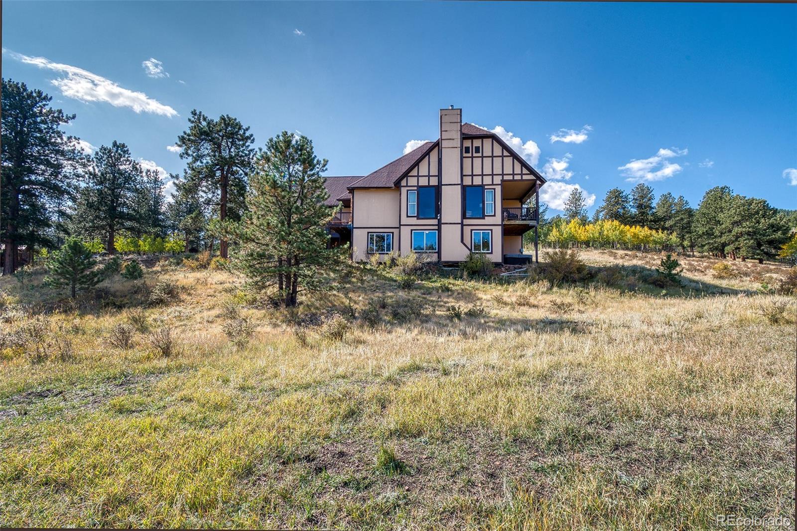 416 Conestoga Road Bailey, CO 80421 - Photo 32 of 40 a house view with a outdoor space