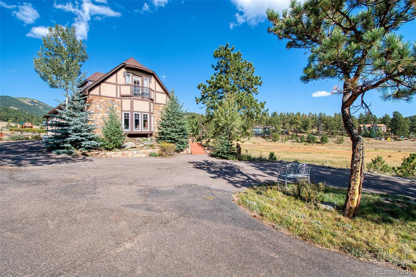 416 Conestoga Road Bailey, CO 80421 - Photo 33 of 40 a view of a house with a yard