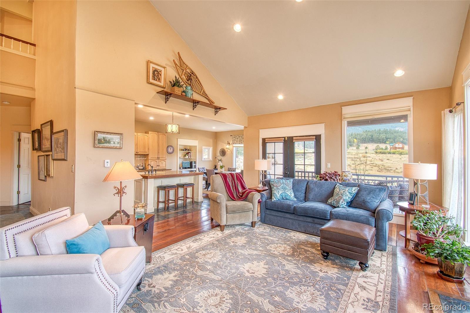 416 Conestoga Road Bailey, CO 80421 - Photo 6 of 40 a living room with furniture and a large window