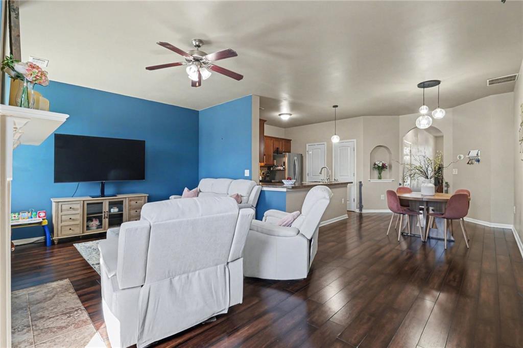 404 East Gate Trail Ball Ground, GA 30107 - Photo 11 of 25 a living room with furniture and a flat screen tv