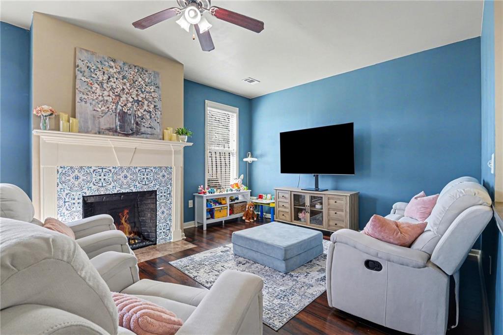 404 East Gate Trail Ball Ground, GA 30107 - Photo 12 of 25 a living room with furniture and a flat screen tv