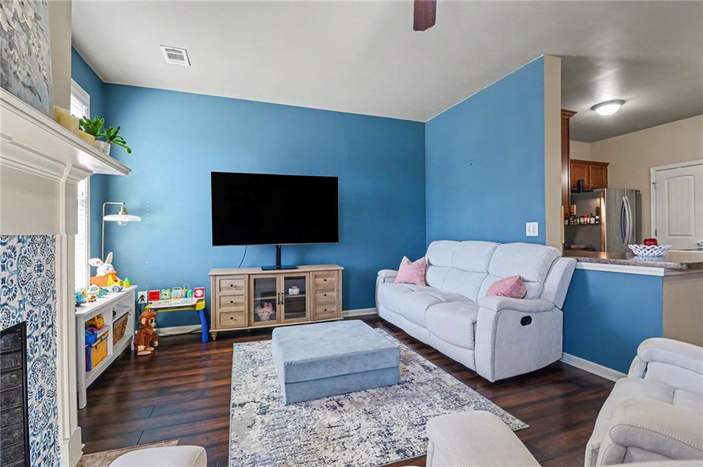 404 East Gate Trail Ball Ground, GA 30107 - Photo 14 of 25 a living room with furniture and a flat screen tv