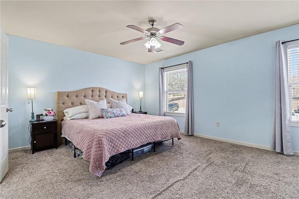 404 East Gate Trail Ball Ground, GA 30107 - Photo 15 of 25 a bedroom with a bed and window
