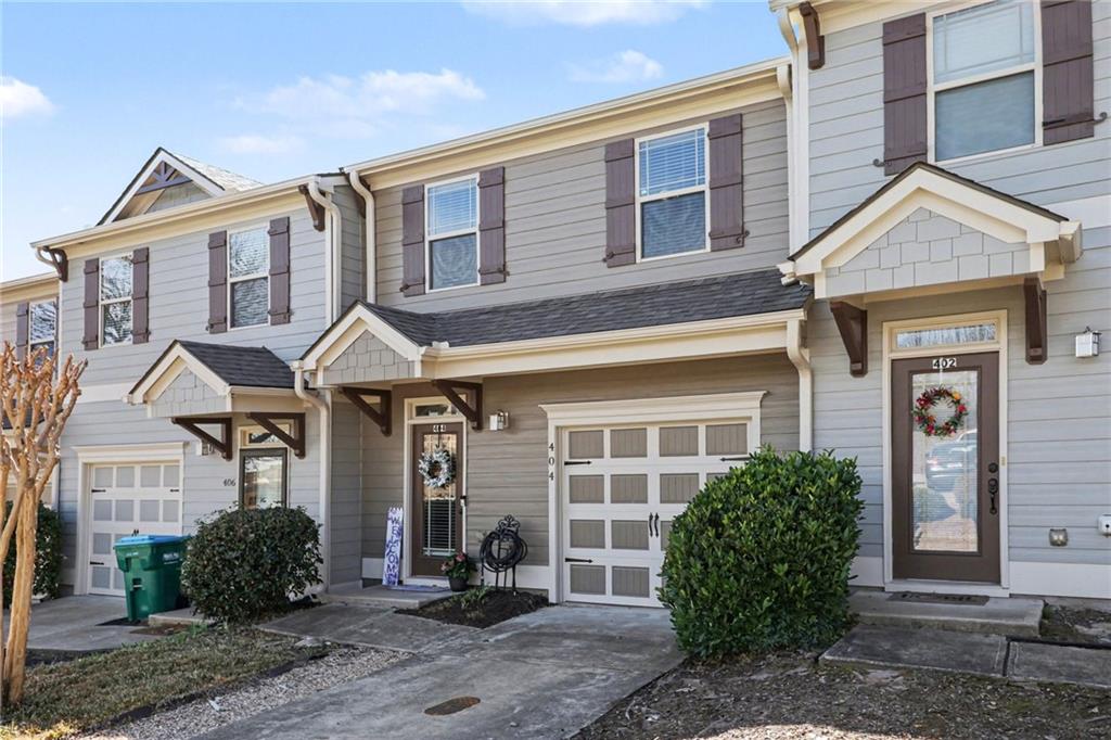 404 East Gate Trail Ball Ground, GA 30107 - Photo 3 of 25 a front view of a house