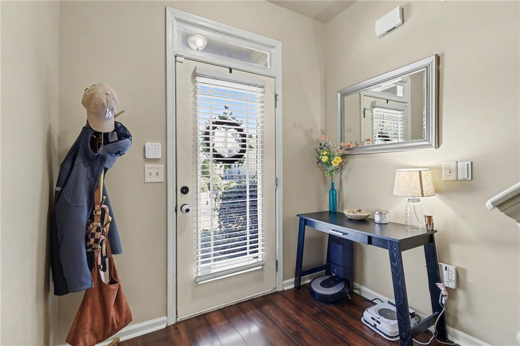 404 East Gate Trail Ball Ground, GA 30107 - Photo 5 of 25 a view of a workspace with furniture and wooden floor