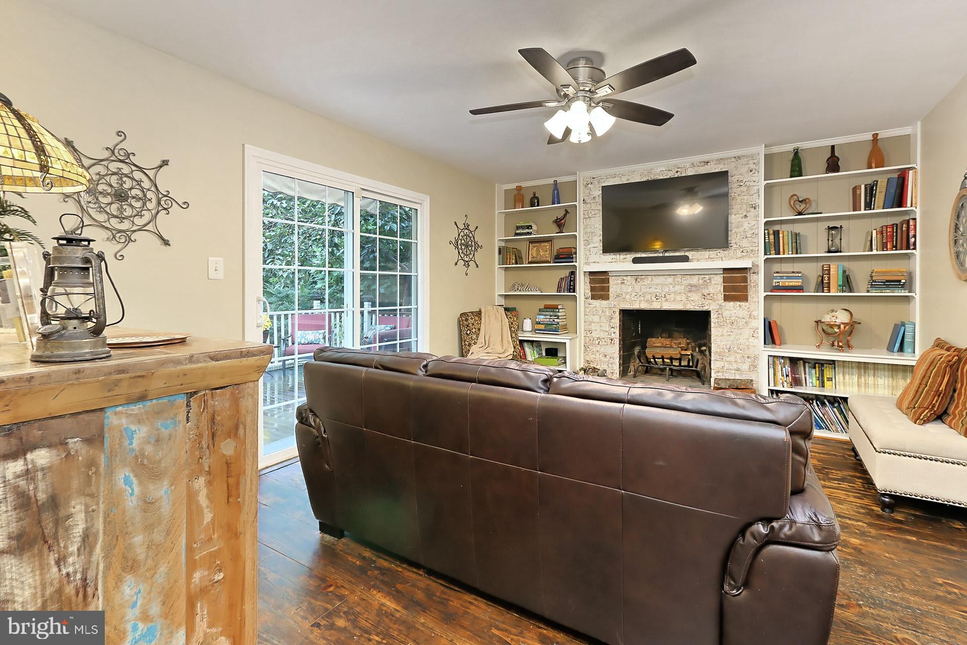 8108 Viola Street Springfield, VA 22152 - Photo 15 of 61 Family room w/newly lined FP & built-in bookcases