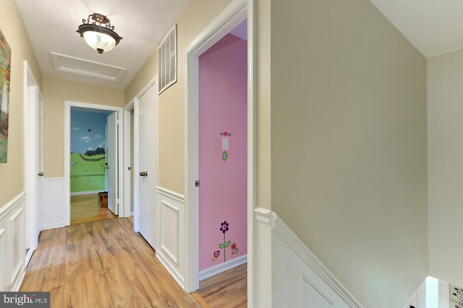 8108 Viola Street Springfield, VA 22152 - Photo 23 of 61 Upper hallway with laminate flooring