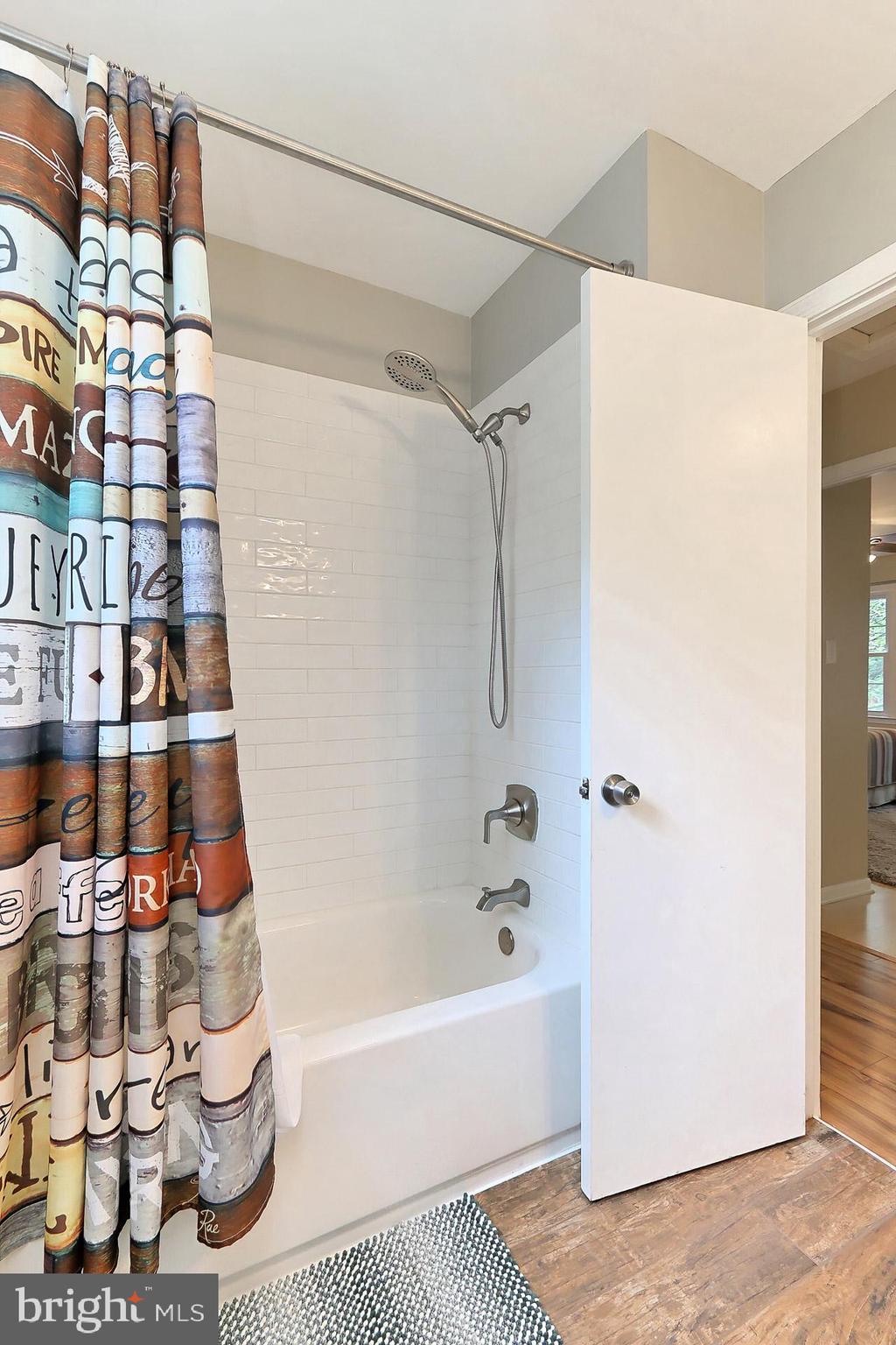 8108 Viola Street Springfield, VA 22152 - Photo 28 of 61 Hall bath features subway tile tub surround