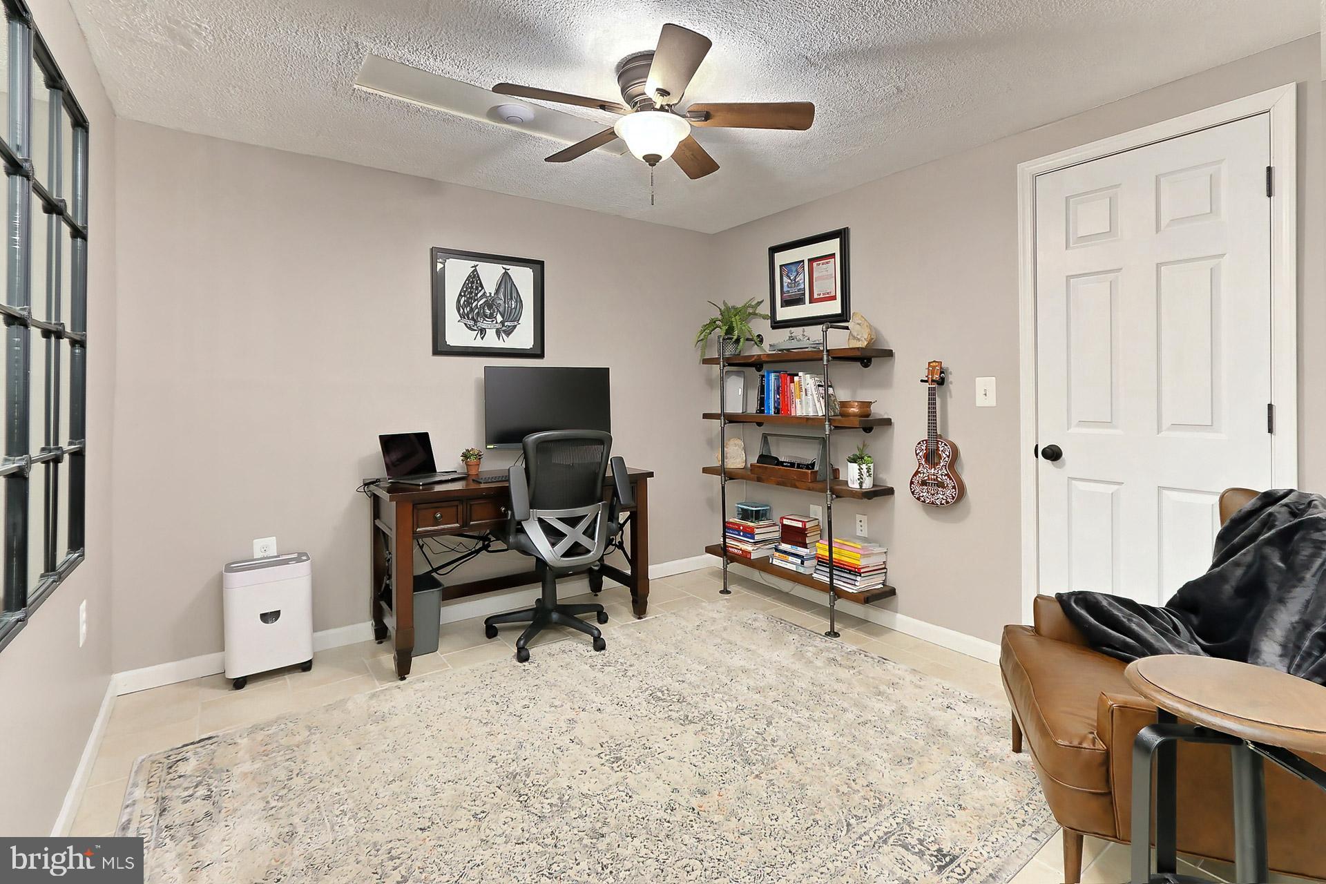 8108 Viola Street Springfield, VA 22152 - Photo 30 of 61 Lower lvl den w/lighted ceiling fan & CT floors