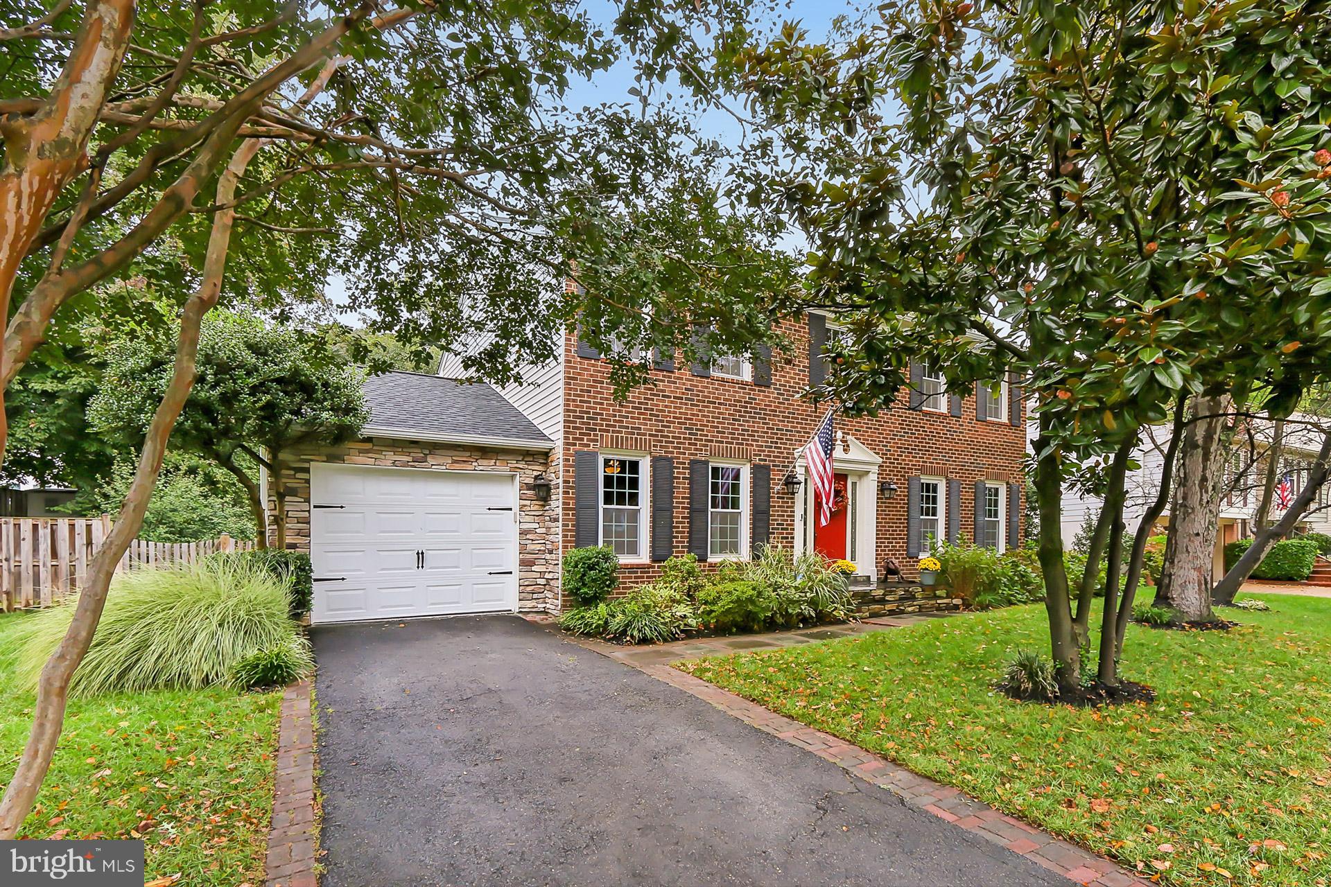 8108 Viola Street Springfield, VA 22152 - Photo 49 of 61 Front. Garage framed in stone