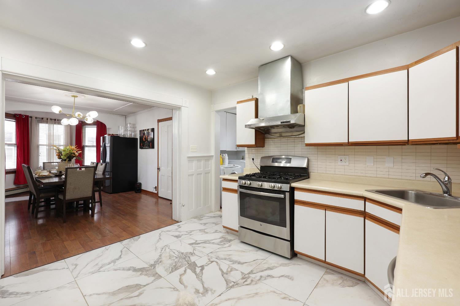 92 Main Street Helmetta, NJ 08828 - Photo 11 of 57 a kitchen with stainless steel appliances granite countertop a stove a sink a refrigerator and a microwave
