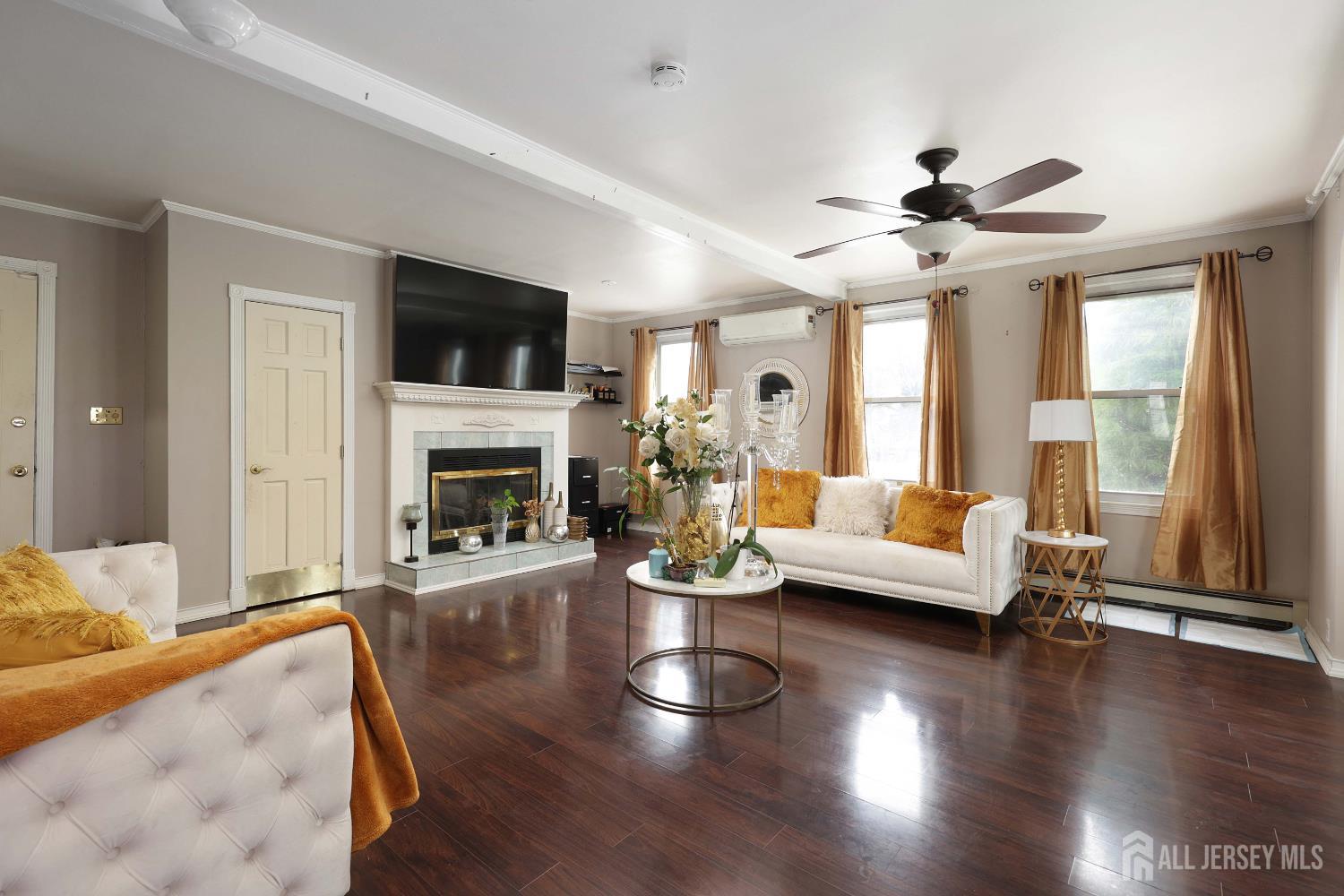 92 Main Street Helmetta, NJ 08828 - Photo 12 of 57 a living room with fireplace furniture and a flat screen tv
