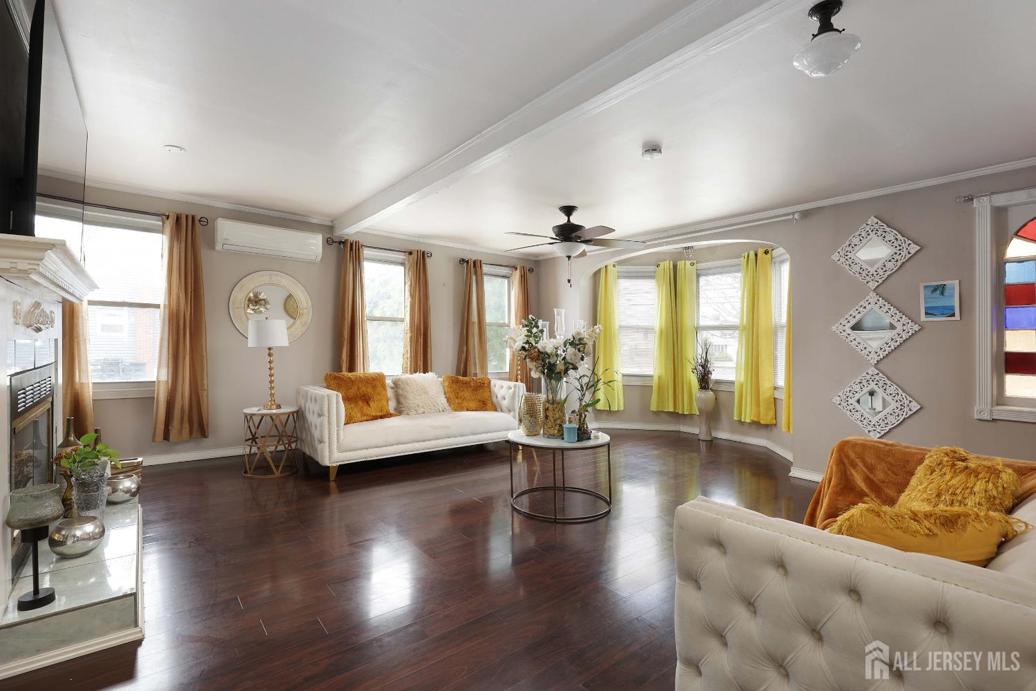 92 Main Street Helmetta, NJ 08828 - Photo 13 of 57 a living room with couches and a large mirror with wooden floor