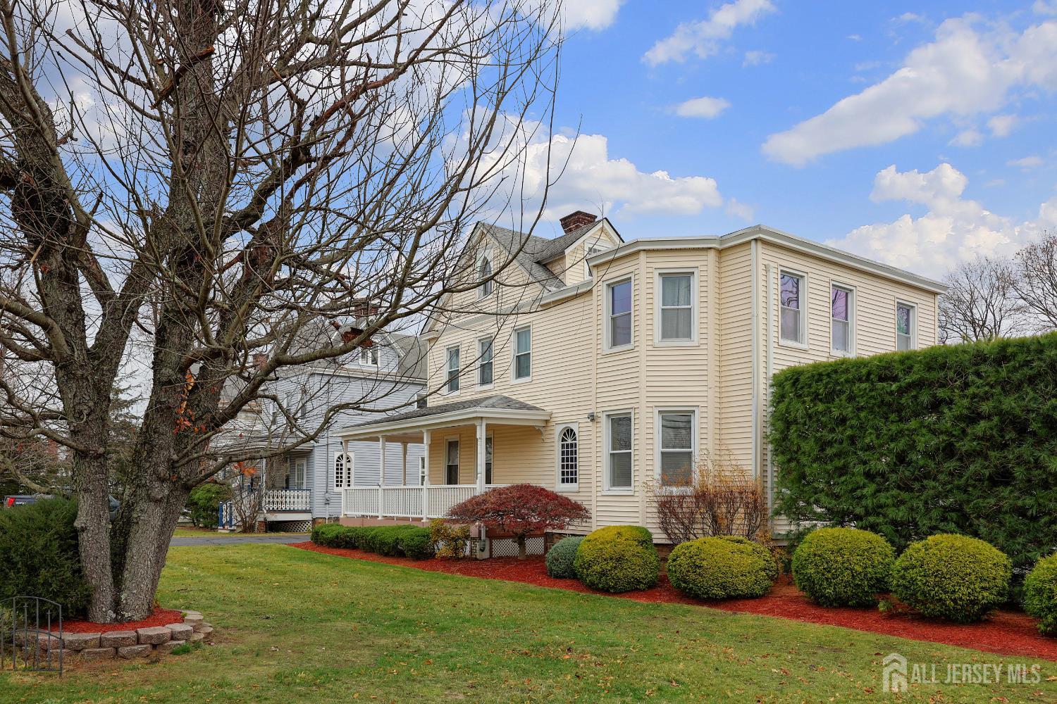 92 Main Street Helmetta, NJ 08828 - Photo 2 of 57 a front view of a house with a garden