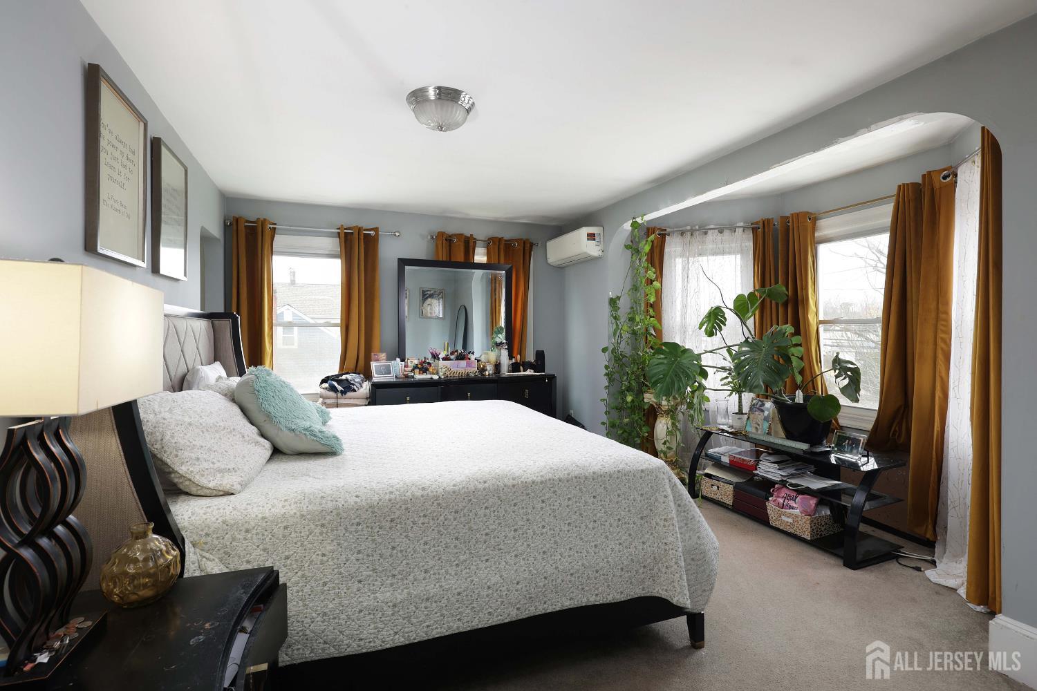 92 Main Street Helmetta, NJ 08828 - Photo 23 of 57 a bedroom with a bed couch and a large window