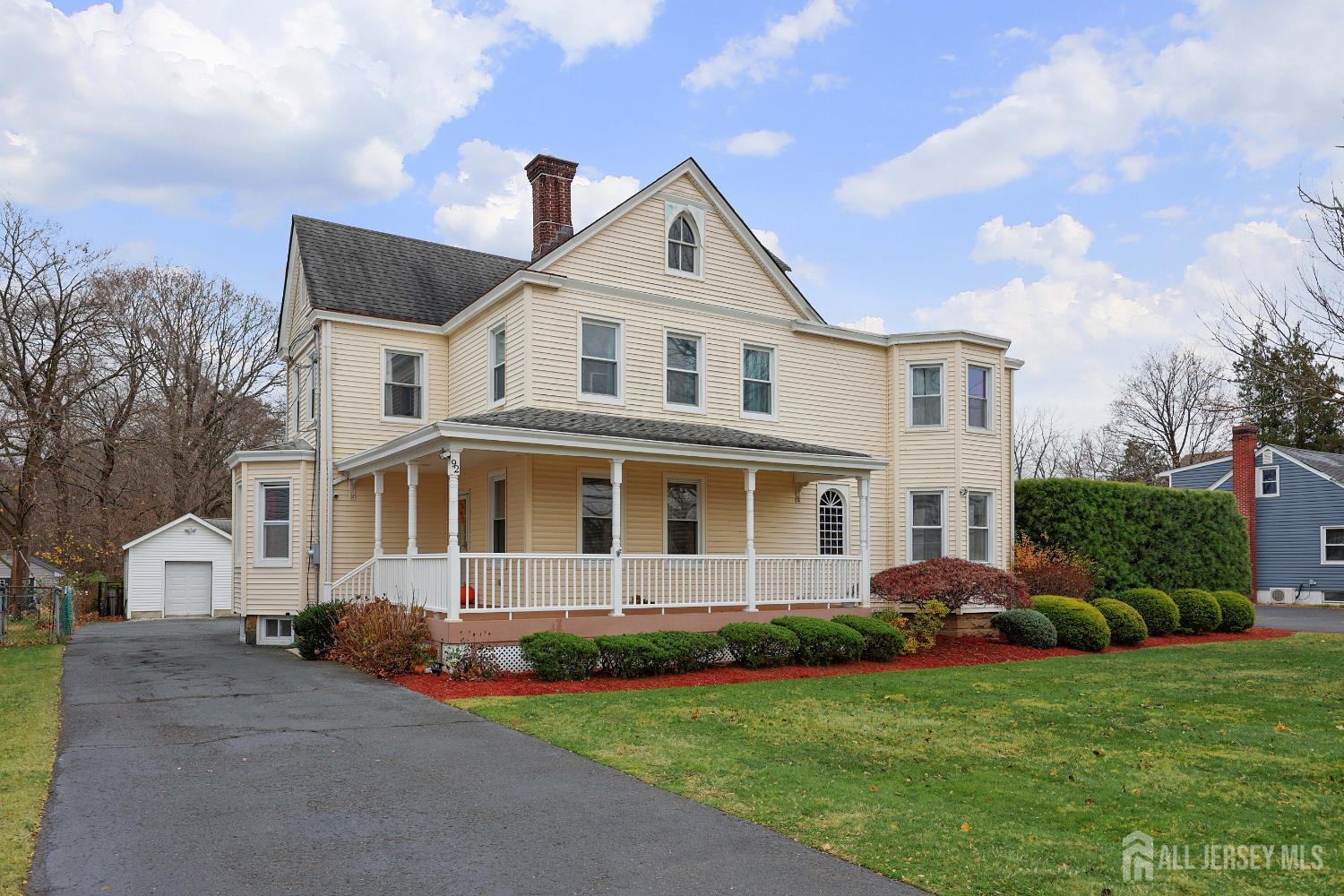 92 Main Street Helmetta, NJ 08828 - Photo 3 of 57 a front view of a house with a yard and trees