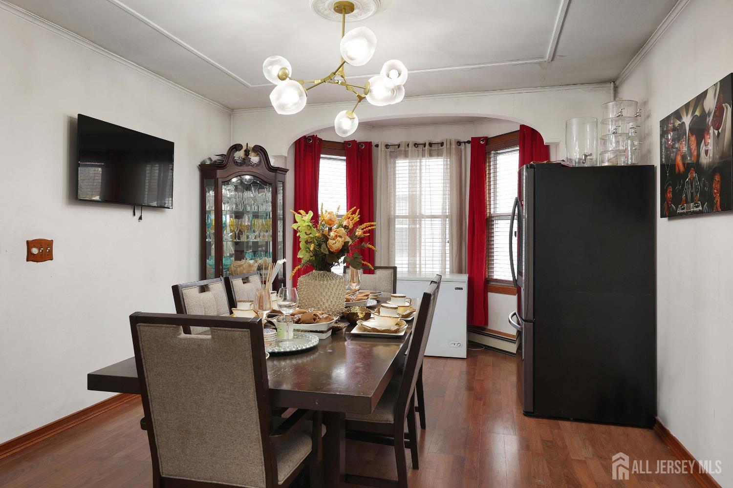 92 Main Street Helmetta, NJ 08828 - Photo 38 of 57 a view of a dining room with furniture a chandelier and wooden floor