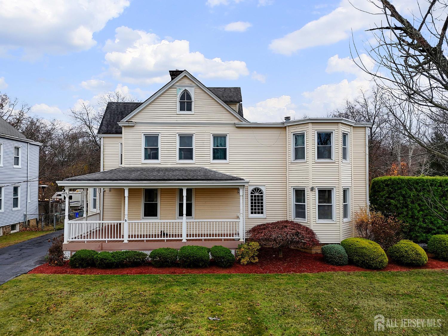 92 Main Street Helmetta, NJ 08828 - Photo 41 of 57 a front view of a house with a yard and potted plants