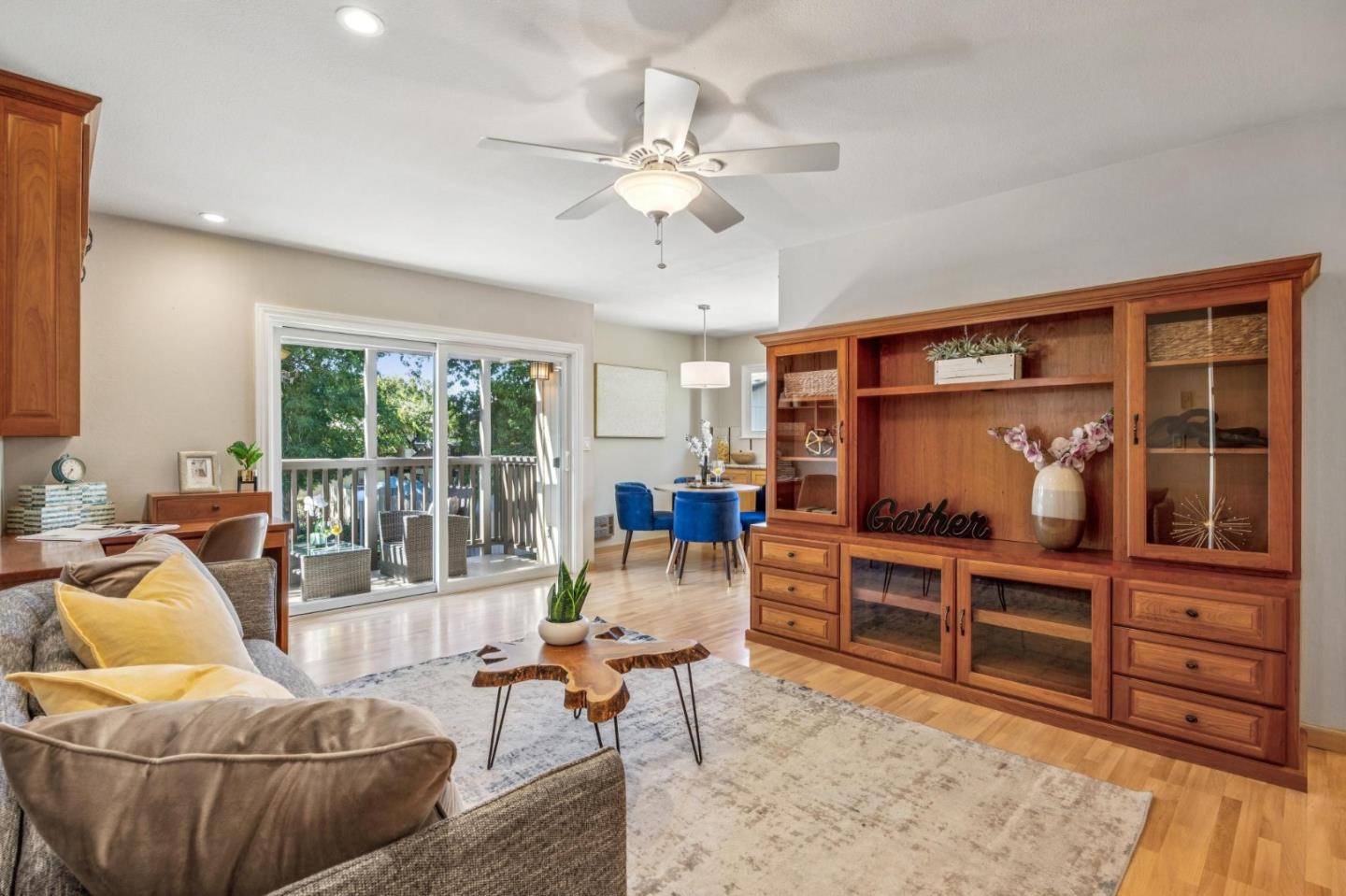 94 Flynn Avenue, Unit D Mountain View, CA 94043 - Photo 1 of 21 a living room with furniture and a flat screen tv