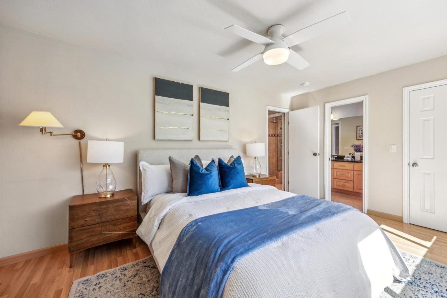 94 Flynn Avenue, Unit D Mountain View, CA 94043 - Photo 12 of 21 a bed room with a bed and a ceiling fan