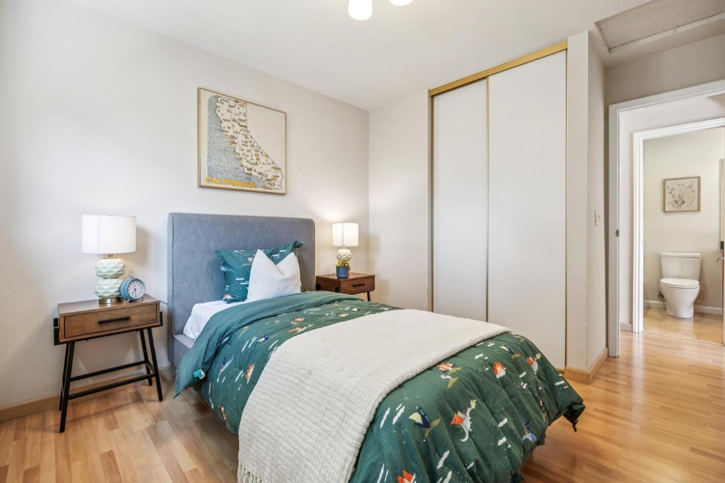 94 Flynn Avenue, Unit D Mountain View, CA 94043 - Photo 14 of 21 a bedroom with a bed and wooden floor