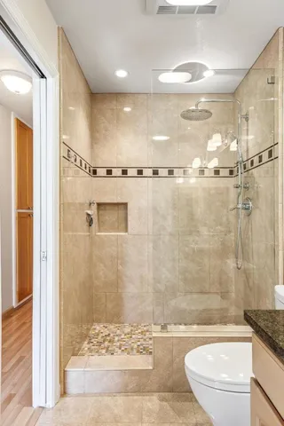 a bathroom with a shower and a sink