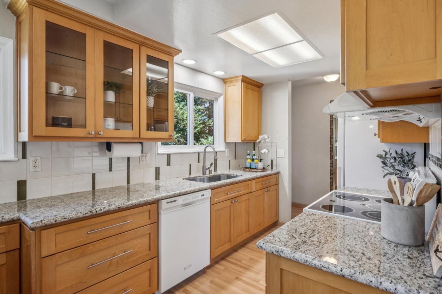 94 Flynn Avenue, Unit D Mountain View, CA 94043 - Photo 3 of 21 a kitchen with stainless steel appliances granite countertop a sink and a granite counter tops