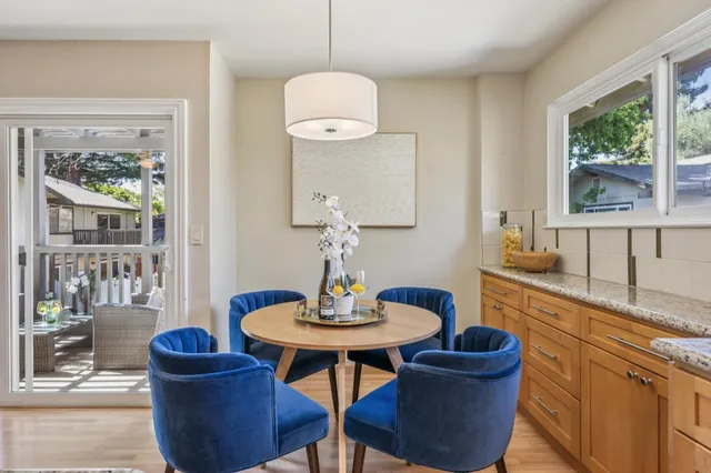 a kitchen with a table and chairs