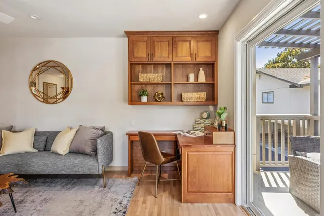 a dining room with furniture and a window