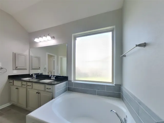 a kitchen with a sink and a window