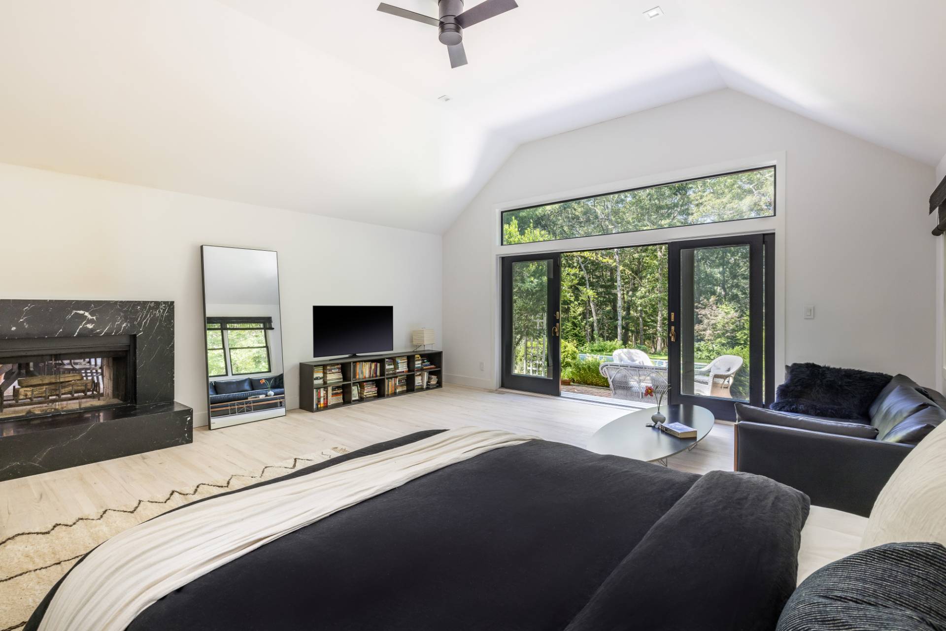 163 Talmage Farm Lane East Hampton, NY 11937 - Photo 12 of 19 a living room with furniture a flat screen tv and a large window