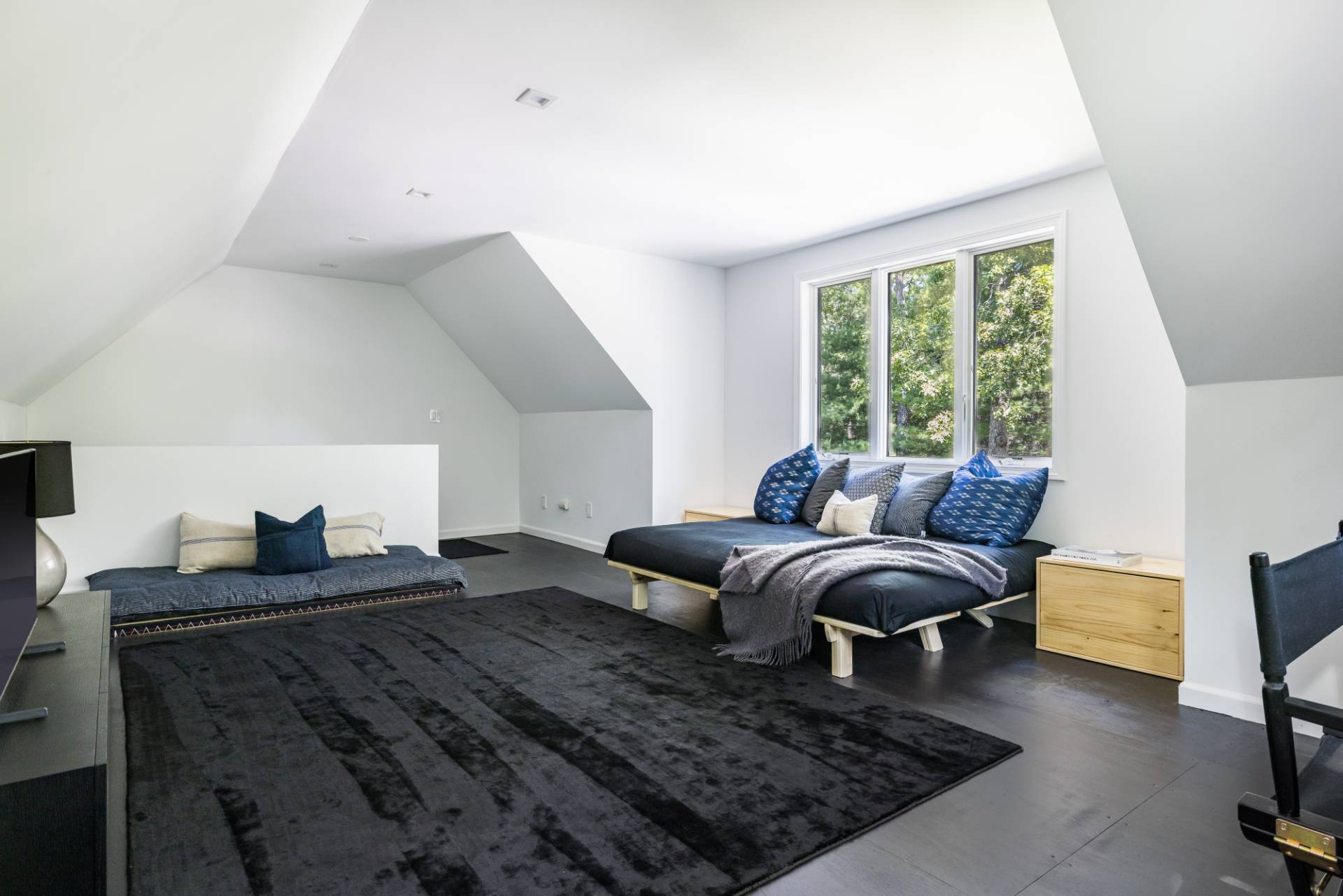 163 Talmage Farm Lane East Hampton, NY 11937 - Photo 17 of 19 a living room with furniture rug and a window