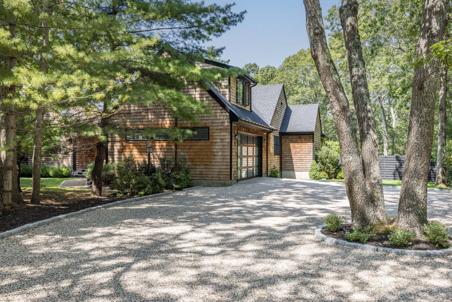 163 Talmage Farm Lane East Hampton, NY 11937 - Photo 19 of 19 a view of a house with a tree in front