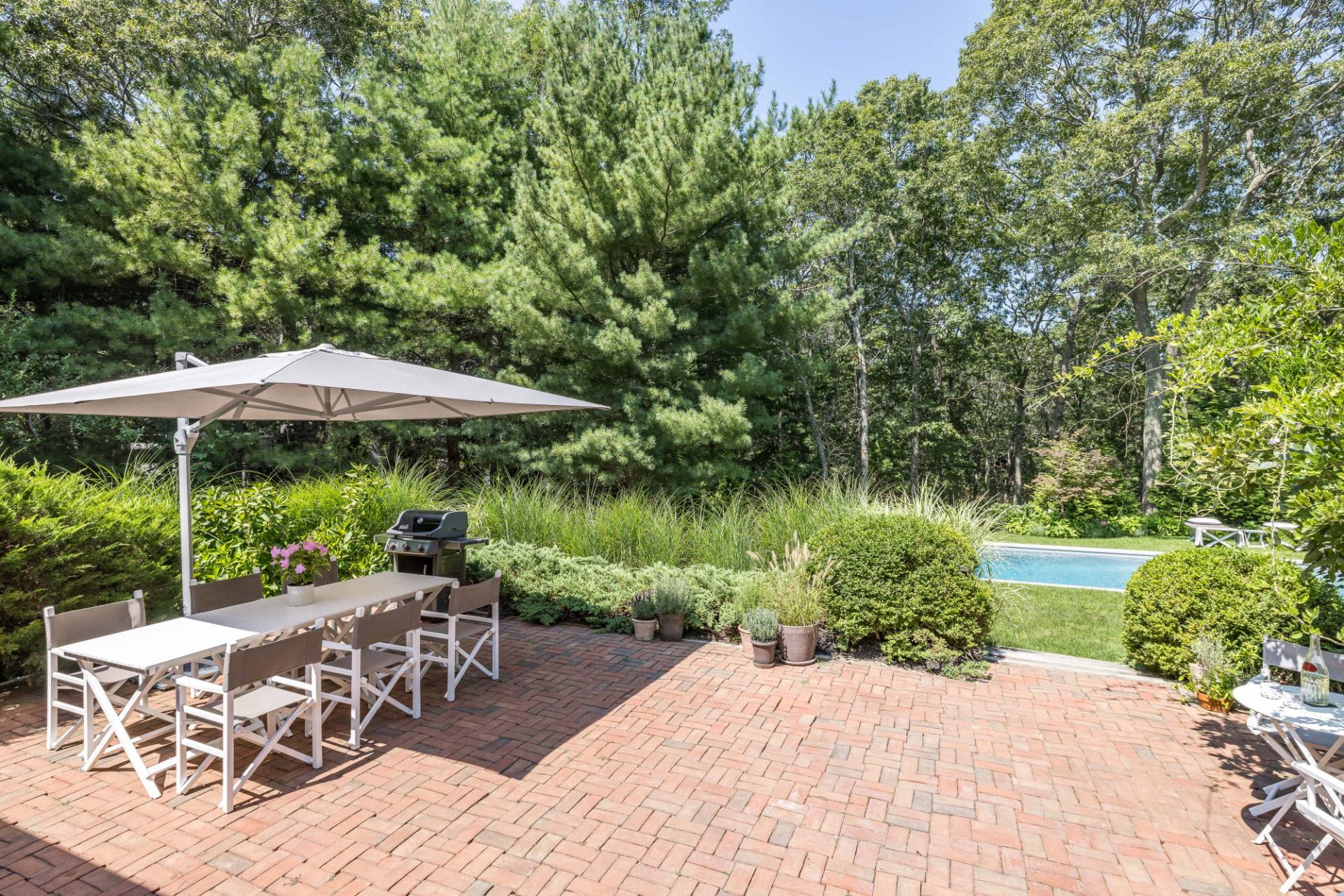 163 Talmage Farm Lane East Hampton, NY 11937 - Photo 5 of 19 a garden view with a seating space