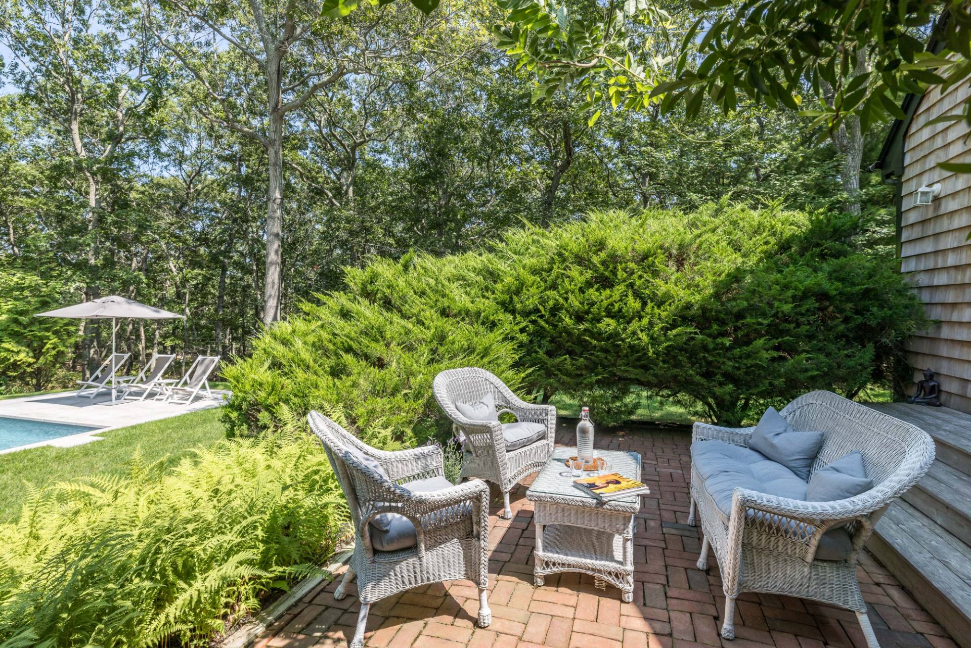 163 Talmage Farm Lane East Hampton, NY 11937 - Photo 6 of 19 a view of a chairs and table in the patio