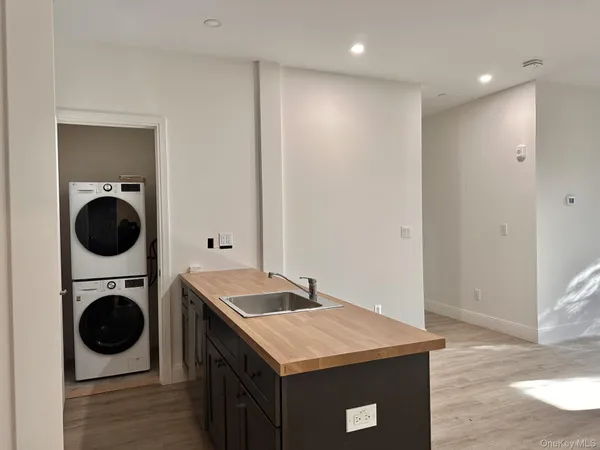 a utility room with a sink a washer and dryer