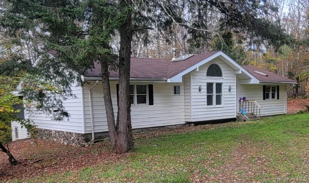 21 Browns Road Livingston Manor, NY 12758 - Photo 1 of 28 a front view of a house with a garden
