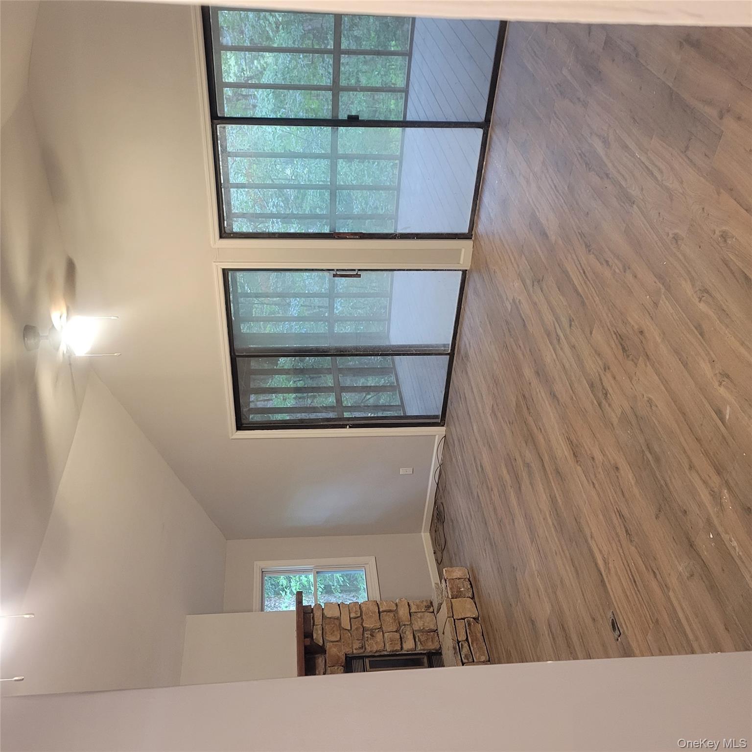 21 Browns Road Livingston Manor, NY 12758 - Photo 16 of 28 an empty room with wooden floor and windows