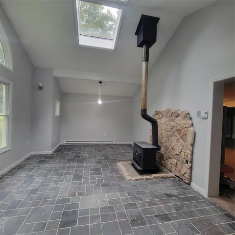 a view of an empty room with a window