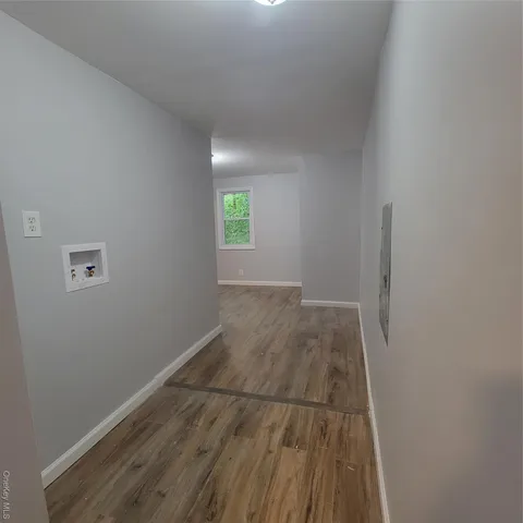 a view of a room with wooden walls