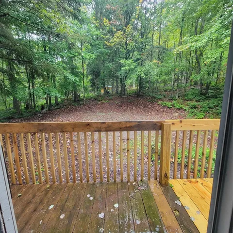 a view of a porch with a yard