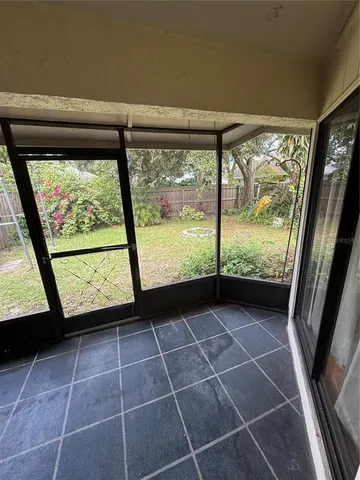 a backyard of a house with lots of green space