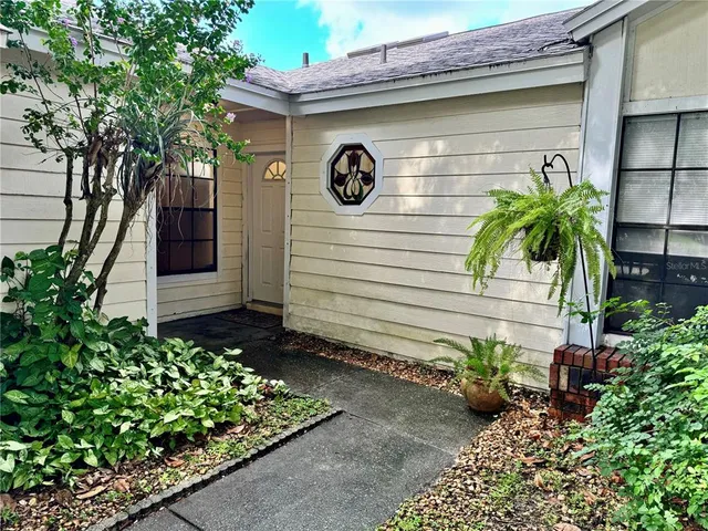 a kitchen with granite countertop white cabinets and stainless steel appliances