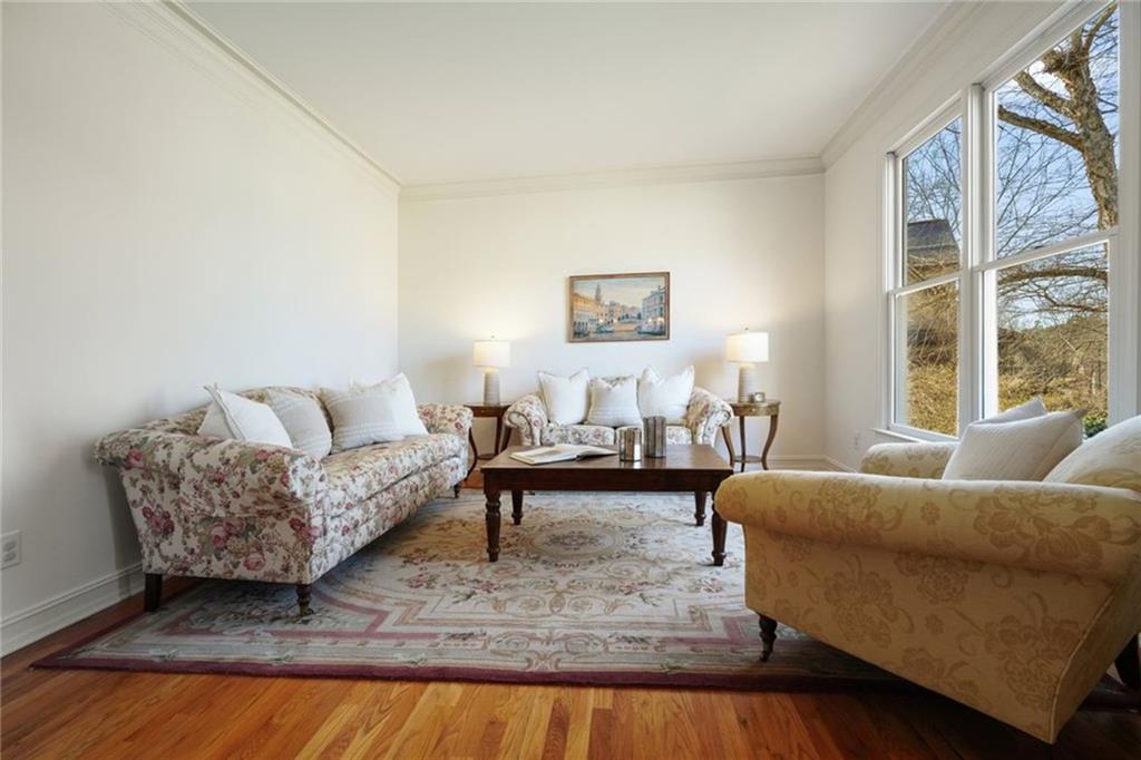 1260 Elk Ridge Cove Alpharetta, GA 30005 - Photo 11 of 87 a living room with furniture and a couch