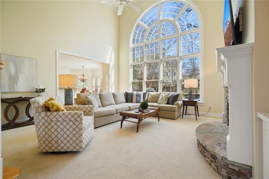 1260 Elk Ridge Cove Alpharetta, GA 30005 - Photo 14 of 87 a living room with furniture and a large window