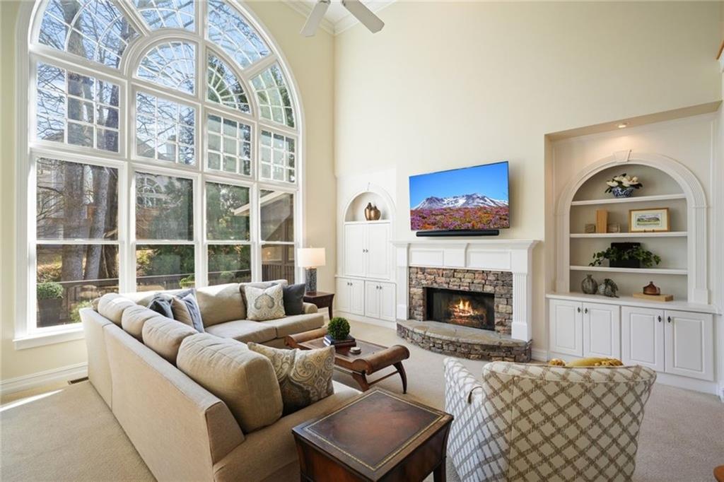 1260 Elk Ridge Cove Alpharetta, GA 30005 - Photo 16 of 87 a living room with furniture and a fireplace