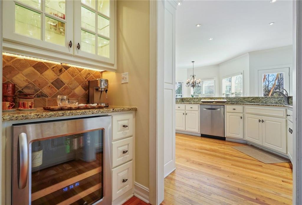 1260 Elk Ridge Cove Alpharetta, GA 30005 - Photo 23 of 87 a kitchen with stainless steel appliances granite countertop a stove and a sink
